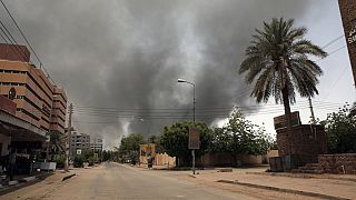 Smoke is seen rising from a neighborhood in Khartoum, Sudan, Saturday, April 15, 2023.
