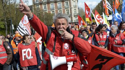 An unionist leads an demonstration against pension reform in Rennes, France. April 13, 2023.