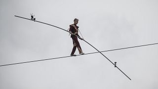 63-year-old circus artist Laszlo Simet walks on a tightrope across the two banks of the river Danube in downtown Budapest on Saturday, April 15, 2023.
