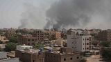 Smoke rises from a central neighborhood of Khartoum, Sudan, Sunday, April 16, 2023