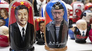 Russian dolls with portraits of Chinese President Xi Jinping and Putin on sale at a shop in Moscow, Russia.