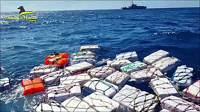 Italian police have seized about 70 packages containing almost 2 tonnes of cocaine floating off eastern Sicily.