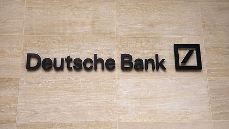  this July 8, 2019 file photo, a Deutsche Bank sign and logo are seen on the outside of their building in London. 