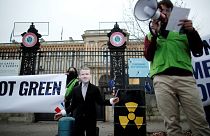 A Green activist attends a protest to denounce French push to include nuclear energy and fossil gas in the EU Green taxonomy.