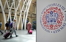 A banner celebrating the coronation of Britain's King Charles III is displayed at Kings Cross Station in London.