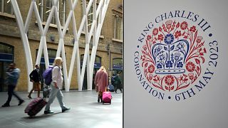 A banner celebrating the coronation of Britain's King Charles III is displayed at Kings Cross Station in London.