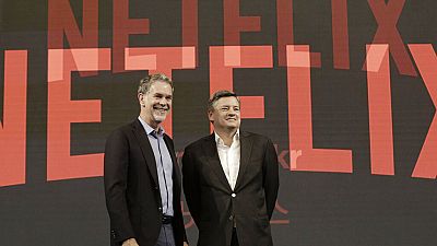 Reed Hastings, left, CEO of Netflix, poses with Ted Sarandos, Chief Content Officer of Netflix, during a press conference in Seoul, South Korea, Thursday, June 30, 2016.