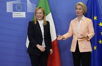 European Commission President Ursula von der Leyen, right, greets Italian Prime Minister Giorgia Meloni prior to a meeting at EU headquarters in Brussels, Nov. 3, 2022.