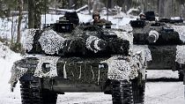 FILE: Denmark's Leopard 2A7 tanks move during the Winter Camp 23 military drills near Tapa, Estonia, Sunday, Feb. 5, 2023.