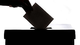 A person casting a vote