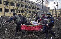 Iryna Kalinina, 32, an injured pregnant woman, is carried from a maternity hospital that was damaged during a Russian airstrike in Mariupol, Ukraine, on 9 March 2022..