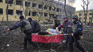 Iryna Kalinina, 32, an injured pregnant woman, is carried from a maternity hospital that was damaged during a Russian airstrike in Mariupol, Ukraine, on 9 March 2022..