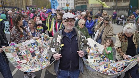 Extinction Rebellion demonstrators take part in a rally on day two of the environmental action group's four days of action, in London, Saturday April 22, 2023