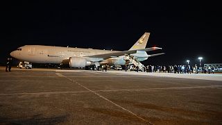 An Air Force plane carrying Italian citizens evacuated from Sudan lands at the Ciampino Military airport in Rome, Monday, April 24, 2023