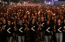 A torchlight procession marches during a demonstration in Yerevan, Armenia