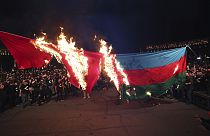 Demonstrators set representations of Turkish and Azerbaijani flags on fire in Yerevan, Armenia, Sunday, April 23, 2023