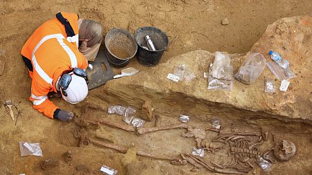 An archaeologist from the French National Institute for Preventive Archaeological Research works on an ancient necropolis at Port-Royal metro station in Paris.