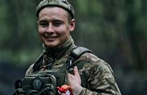 A Ukrainian soldier smiles on the frontline in Bakhmut, Donetsk region, Ukraine, Sunday, April 23, 2023.