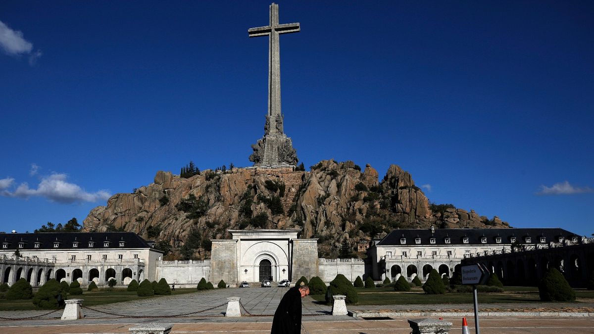 A friar walks in front of the Valle de los Caidos (Valley of the Fallen) mausoleum on the outskirts of Madrid, Spain