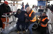 A disable man is helped climbing the stair to access the platform Wednesday, April 26, 2023 at the Melun train station, outside Paris.