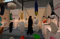A woman looks at the 'Plastic on Stage' installation by Bozen's university at 2023's Milan Design Week