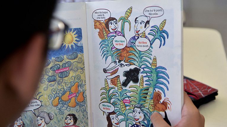 A student reads a book in Guarani during a class at a school in Asuncion on April 20, 2023.