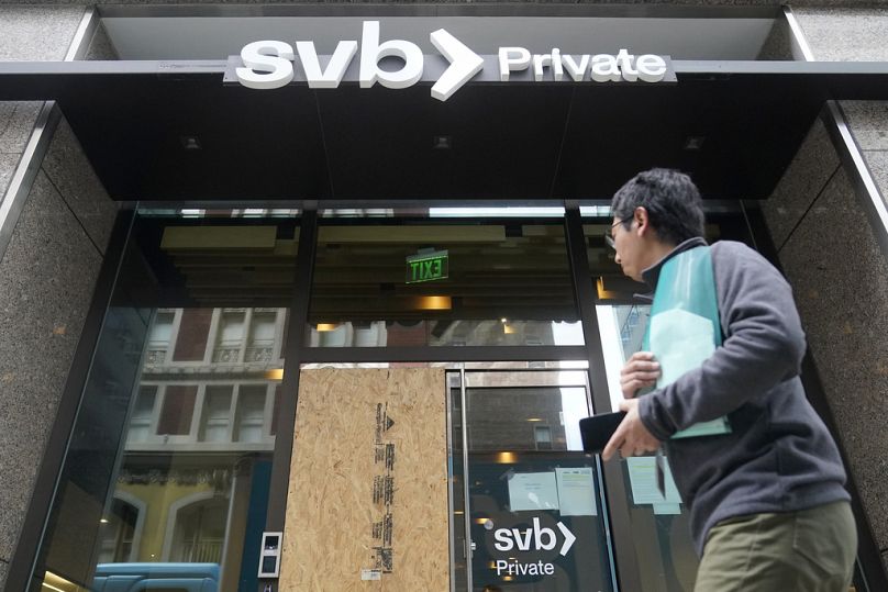 A pedestrian passes a Silicon Valley Bank branch in San Francisco, March 2023