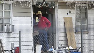 San Jacinto County Sheriff Greg Capers talks to investigators at the scene where five people were shot and killed the night before, Saturday, April 29, 2023.