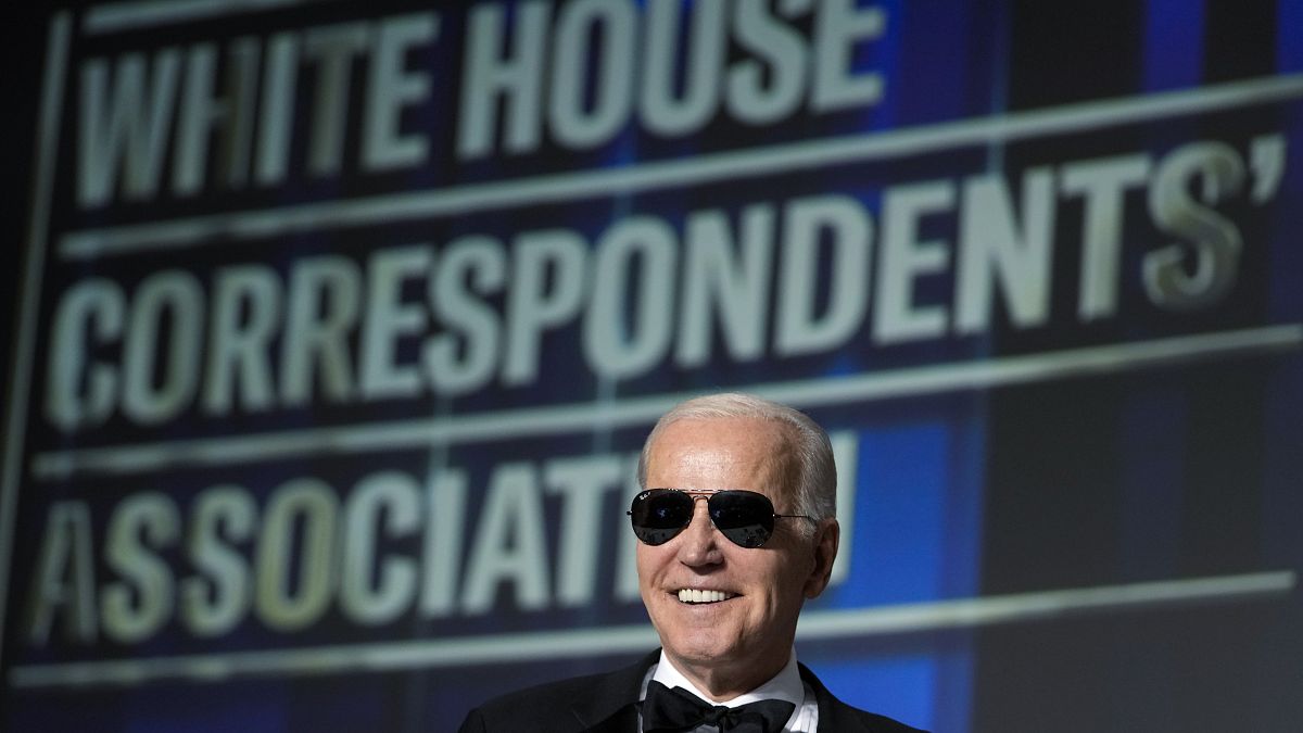 President Joe Biden wears sunglasses after making a joke about becoming the "Dark Brandon" persona during the White House Correspondents' Association dinner in Washington, DC.