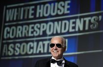 President Joe Biden wears sunglasses after making a joke about becoming the "Dark Brandon" persona during the White House Correspondents' Association dinner in Washington, DC.
