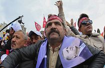 People listen to Turkish President and People's Alliance's presidential candidate Recep Tayyip Erdogan during an election campaign rally in Ankara, Sunday, April 30, 2023.