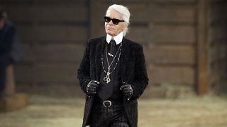 Met Gala subject Karl Lagerfeld takes a bow at the end of his Metiers d'Art fashion show in Dallas in 2013