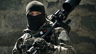 A Ukrainian army sniper looks on near Bakhmut, Donetsk region, Ukraine, Tuesday, May 2, 2023.
