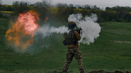 A Ukrainian soldier fires an RPG during his training at the frontline positions near Vuhledar, Donetsk region, Ukraine, Monday, May 1, 2023.