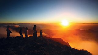 Sonnenaufgang auf dem Gipfel des Apo
