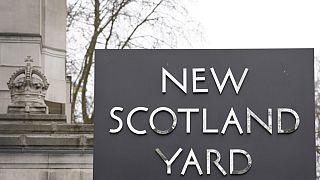 A sign outside New Scotland Yard, the headquarters of the London Metropolitan Police, in London, Tuesday, March 21, 2023. 