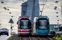 Trams are pictured near the European Central Bank in Frankfurt, Germany.   -