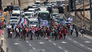 Israelis block roads in protest against Netanyahu legal plan in Tel Aviv, Israel. 