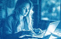 An illustration of a person working on their laptop