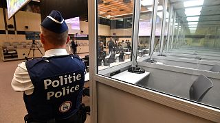 A police officer at the Justitia building in Brussels, Monday, Sept. 12, 2022.