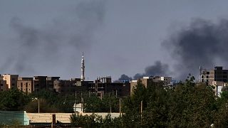 Smoke billows during fighting in the Sudanese capital Khartoum. 