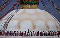 Tamang community people stand in a queue to offer prayers during the Temal festival at Boudhanath Stupa in Kathmandu, Nepal, Wednesday, April 5, 2023. 