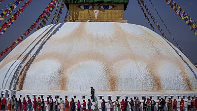 Tamang community people stand in a queue to offer prayers during the Temal festival at Boudhanath Stupa in Kathmandu, Nepal, Wednesday, April 5, 2023. 