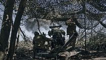 Ukrainian soldiers fire a cannon near Bakhmut, an eastern city where fierce battles against Russian forces have been taking place, in the Donetsk region, Ukraine