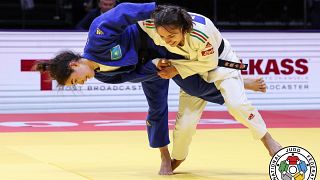 Sabina Giliazova of Russia and Blandine Pont of France, bottom, in action during the women's -48 category at the World Judo Championships in Doha, Qatar, Sunday, April 5, 2023