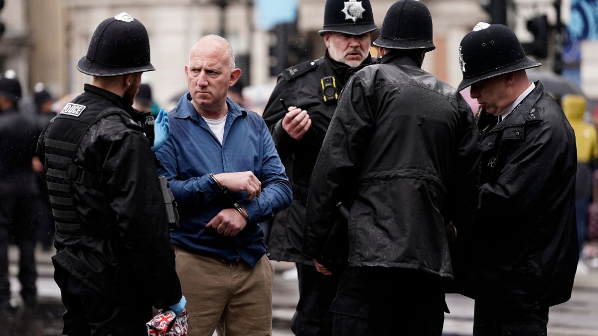 Police arrest an anti-monarchy demonstrators ahead of the procession of Britain's King Charles III to Westminster Abbey for his coronation in London Saturday, May 6, 2023. 