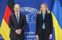 German Chancellor Olaf Scholz stands with European Parliament President Roberta Metsola in Strasbourg, eastern France, May 9, 2023.