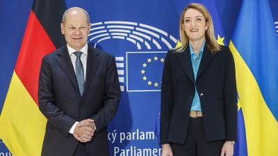 German Chancellor Olaf Scholz stands with European Parliament President Roberta Metsola in Strasbourg, eastern France, May 9, 2023.