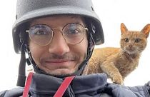 AFP journalist Arman Soldin snaps a selfie with a cat on his shoulder during an assignment for AFP in Ukraine. 
