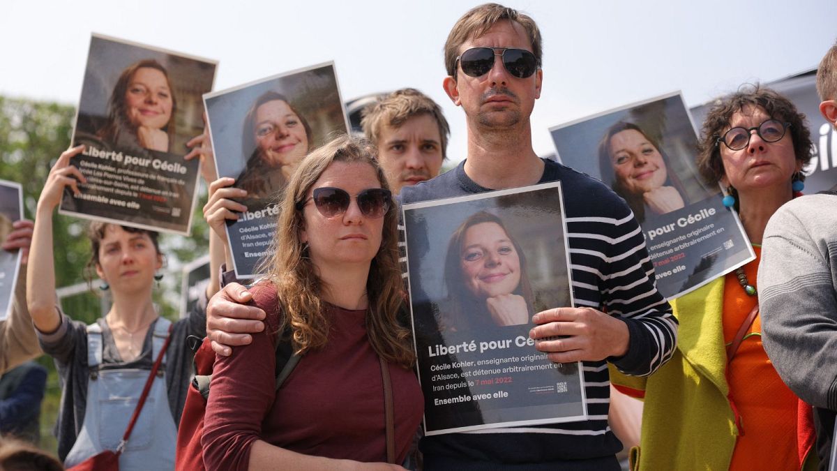 The support group of French hostage Cecile Kohler, held in Iran, gather to demand her release.